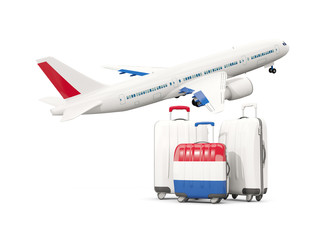 Luggage with flag of netherlands. Three bags with airplane