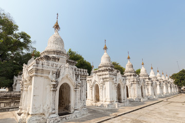 Fototapeta na wymiar Some of the 729 stupas known as the world's largest book at the Kuthodaw Pagoda in Mandalay, Myanmar (Burma).