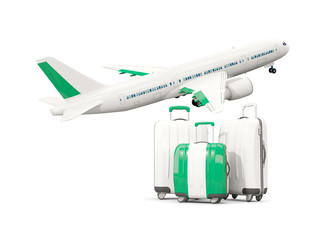 Luggage with flag of nigeria. Three bags with airplane