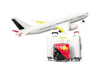 Luggage with flag of papua new guinea. Three bags with airplane