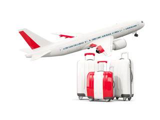 Luggage with flag of peru. Three bags with airplane