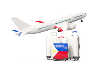 Luggage with flag of philippines. Three bags with airplane