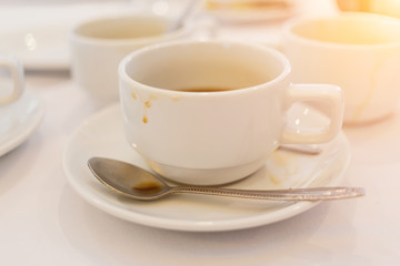 Soft focus and blurred photo of grunge used coffee cups after finished coffee break time.