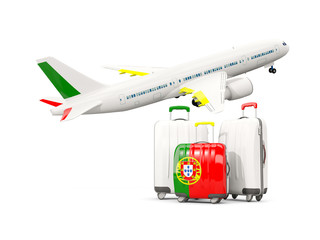Luggage with flag of portugal. Three bags with airplane