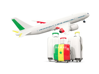 Luggage with flag of senegal. Three bags with airplane