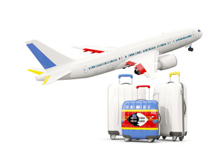 Luggage with flag of swaziland. Three bags with airplane