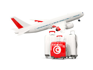 Luggage with flag of tunisia. Three bags with airplane