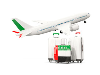 Luggage with flag of united arab emirates. Three bags with airplane