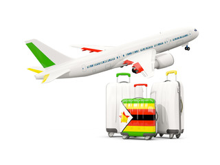 Luggage with flag of zimbabwe. Three bags with airplane
