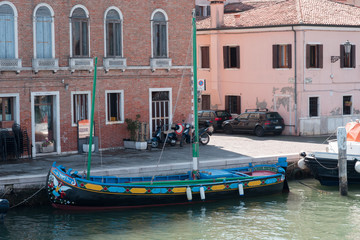 Fototapeta na wymiar Boats and lighthouses in the Venetian Lagoon. Chioggia, Venice