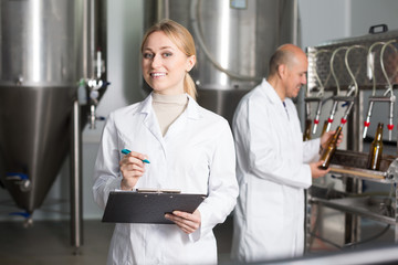 Portrait of smiling young woman employee