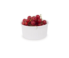 Bowl with redcurrants isolated on white background. Ripe currants close-up. Background berry. Sweet and juicy berry with copy space for text.