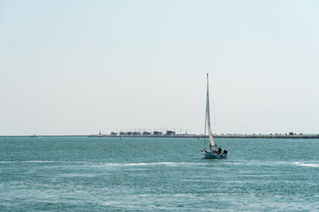 Fototapeta premium Boats and lighthouses in the Venetian Lagoon. Chioggia, Venice