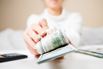 Hands counting money, close up