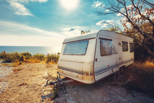 Caravan trailer on background sea holiday vacation trip concept