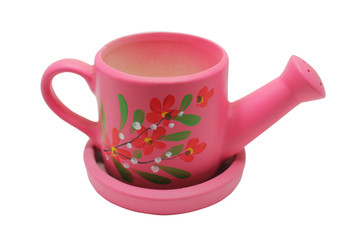 Small pink watering can on white background