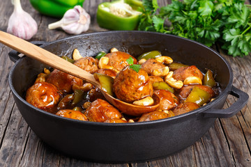 Chicken meatballs tossed with sauce, top view