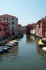 Reflections along the canals of Chioggia, Venice and its lagoon.