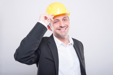 Portrait of foreman smiling holding his hardhat