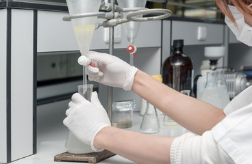 Scientist working in laboratory, testing samples