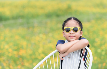 cute girl and yellow flower background