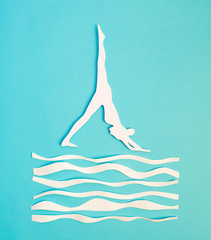 Banner yoga. Woman standing in pose on a lake. Everything is made of paper.