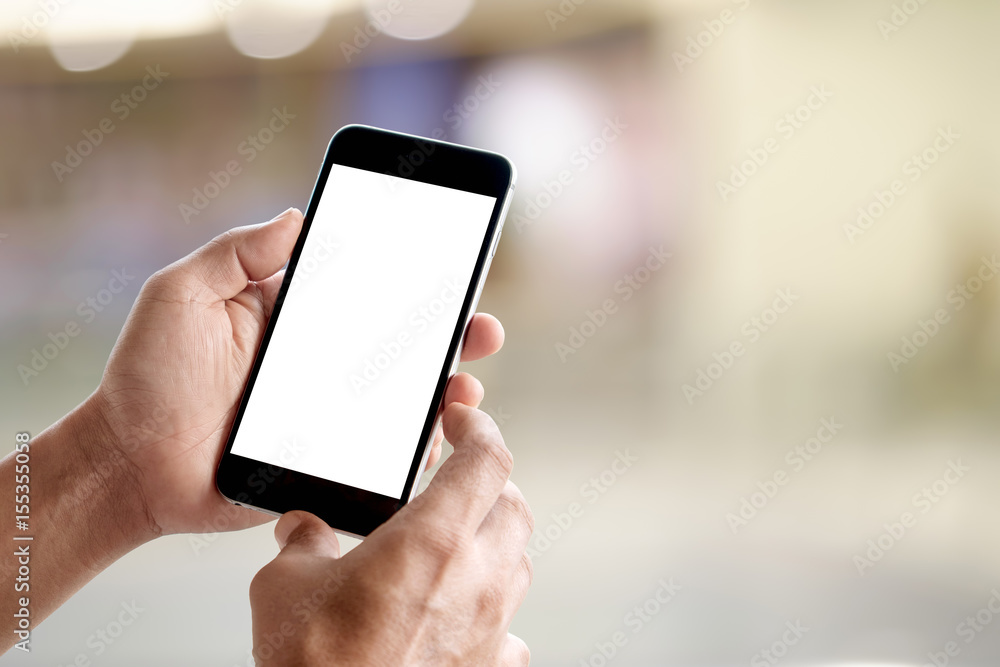 Poster man holding smart phone with blurred backgroung. blank screen for graphic display montage.
