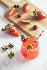 Strawberry iced drink in a marble table