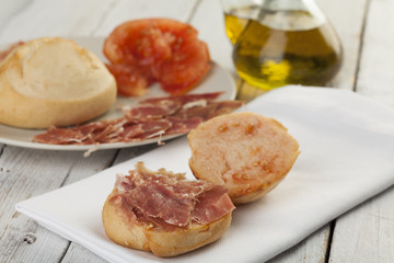 Naklejka na ściany i meble Pan tumaca. Bread with tomato and jamon serrano with olive oil
