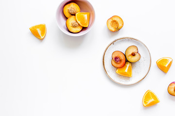woman summer breackfast with orange and peach fruits on white background flat lay mockup