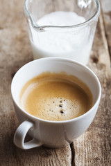 Delicious coffee cup on wooden background
