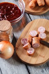 Ingredients ready for preparing German currywurst with curry sau