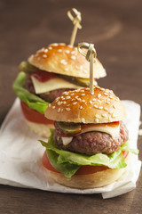     Deluxe gourmet burger on wooden table 