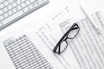 business accounter work with taxes and keyboard on white office desk top view