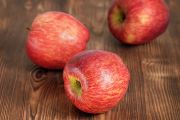 Red apples on a wooden table