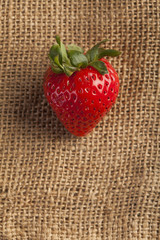 Strawberries on hessian sack background