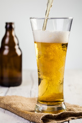 Glass of beer and bottle