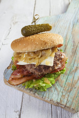     Deluxe gourmet burger on wooden table 