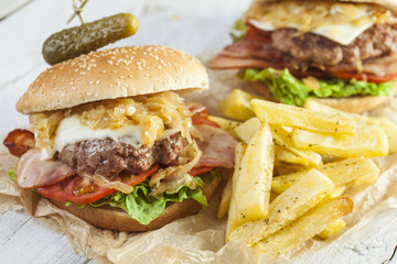     Deluxe gourmet burger on wooden table 