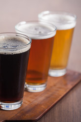     Assorted beers in a flight ready for tasting 