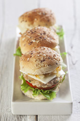 Deluxe gourmet burger on wooden table