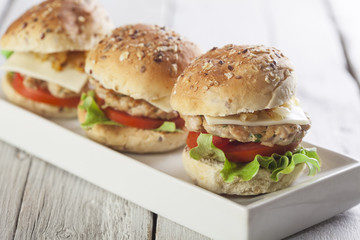 Deluxe gourmet burger on wooden table