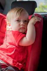 Little girl in car safety seat
