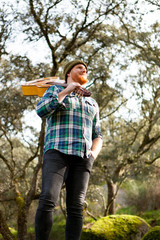 Hipster man with red beard and a guitar relaxs