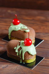 Chocolate pastry cake dessert with cherry