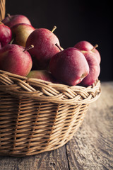 Red apples on wooden background