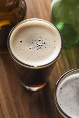 Glass of beer on wooden background