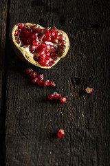 Pomegranate on a dark wooden background