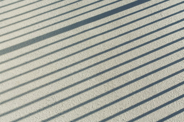 Stripe shadow on cement floor or cement wall