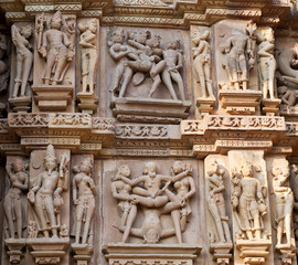Ancient reliefs with lovers at famous erotic temple in Khajuraho, India